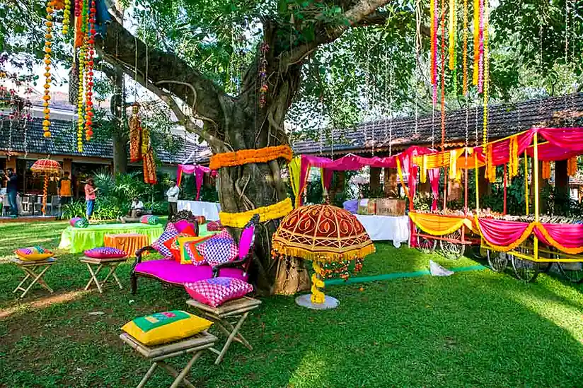 Alila Diwa Goa colorful mehndi ceremony setup in the resort garden with traditional decor