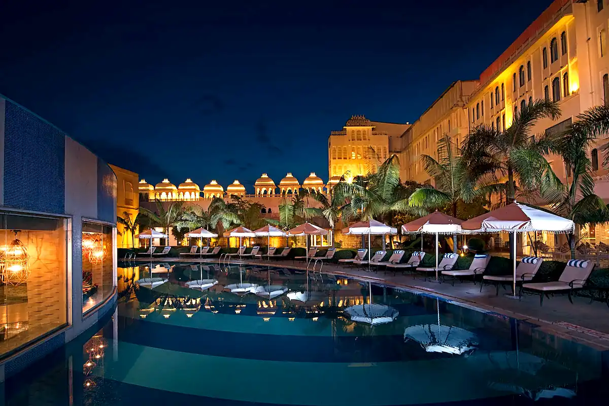 Luxury Resort Wedding Venue in Udaipur with Pool and Palace Architecture at Night