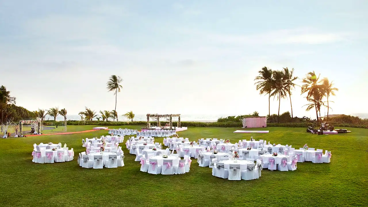Grand Hyatt Goa - Expansive Lawn Wedding Setup with Palm Trees and Ocean View