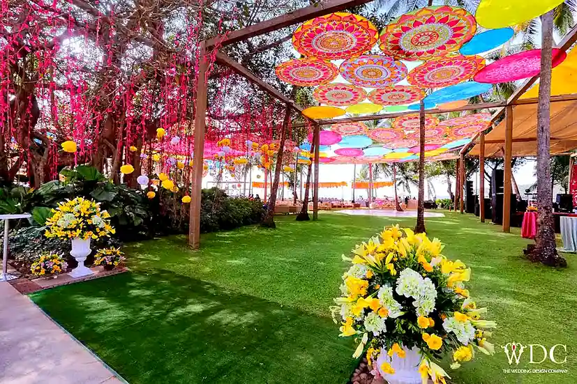 Grand Hyatt Goa - Colorful Mehendi Setup with Umbrella Canopy and Floral Decor