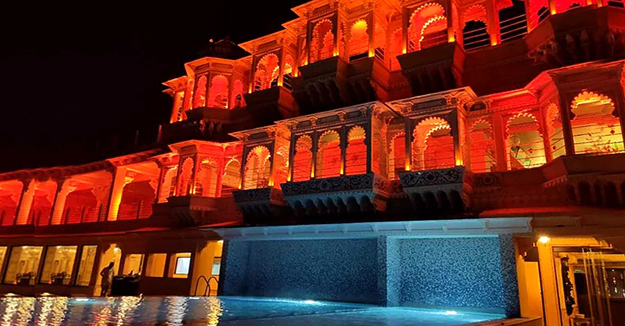 Chunda Palace Udaipur night view with illuminated pool and heritage architecture