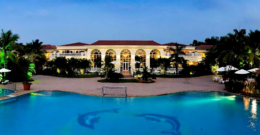 Zuri White Sands Resort Goa - Pool View with Portuguese Architecture at Dusk